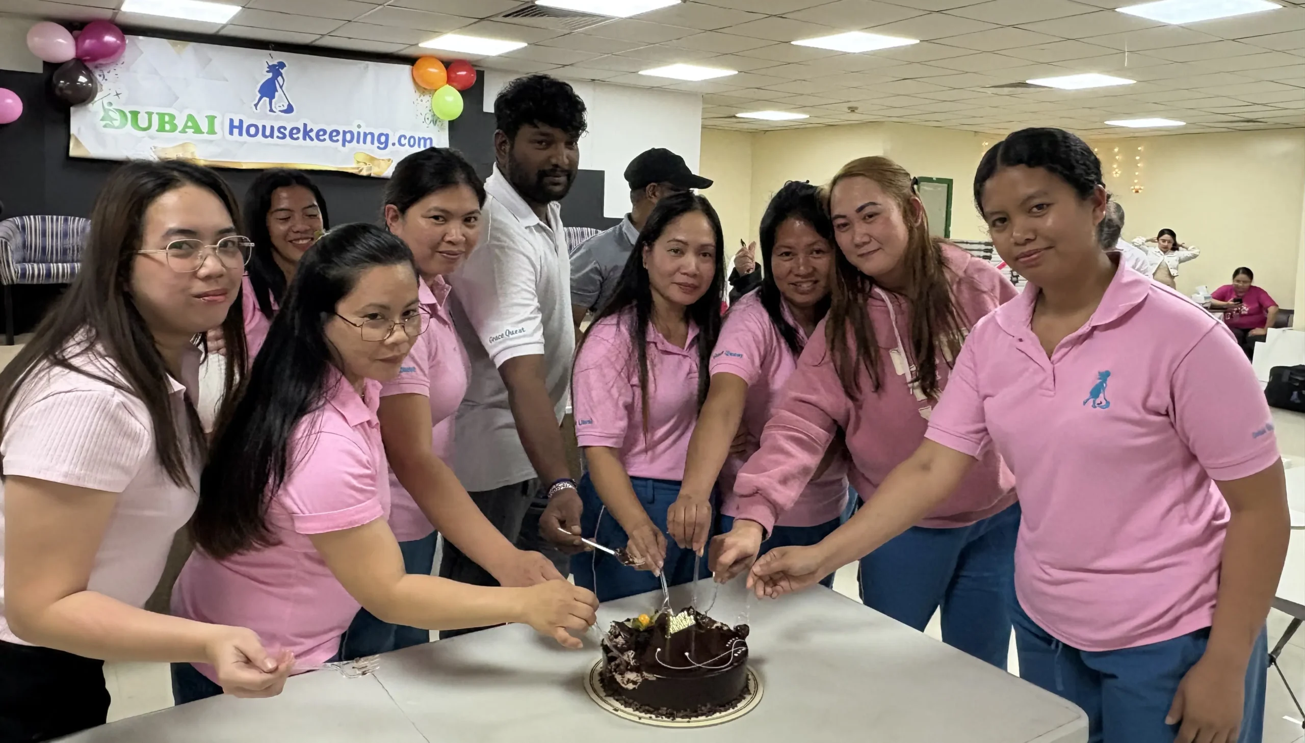 Dubai Housekeeping team members celebrating together during an internal staff gathering and recognition event in Dubai